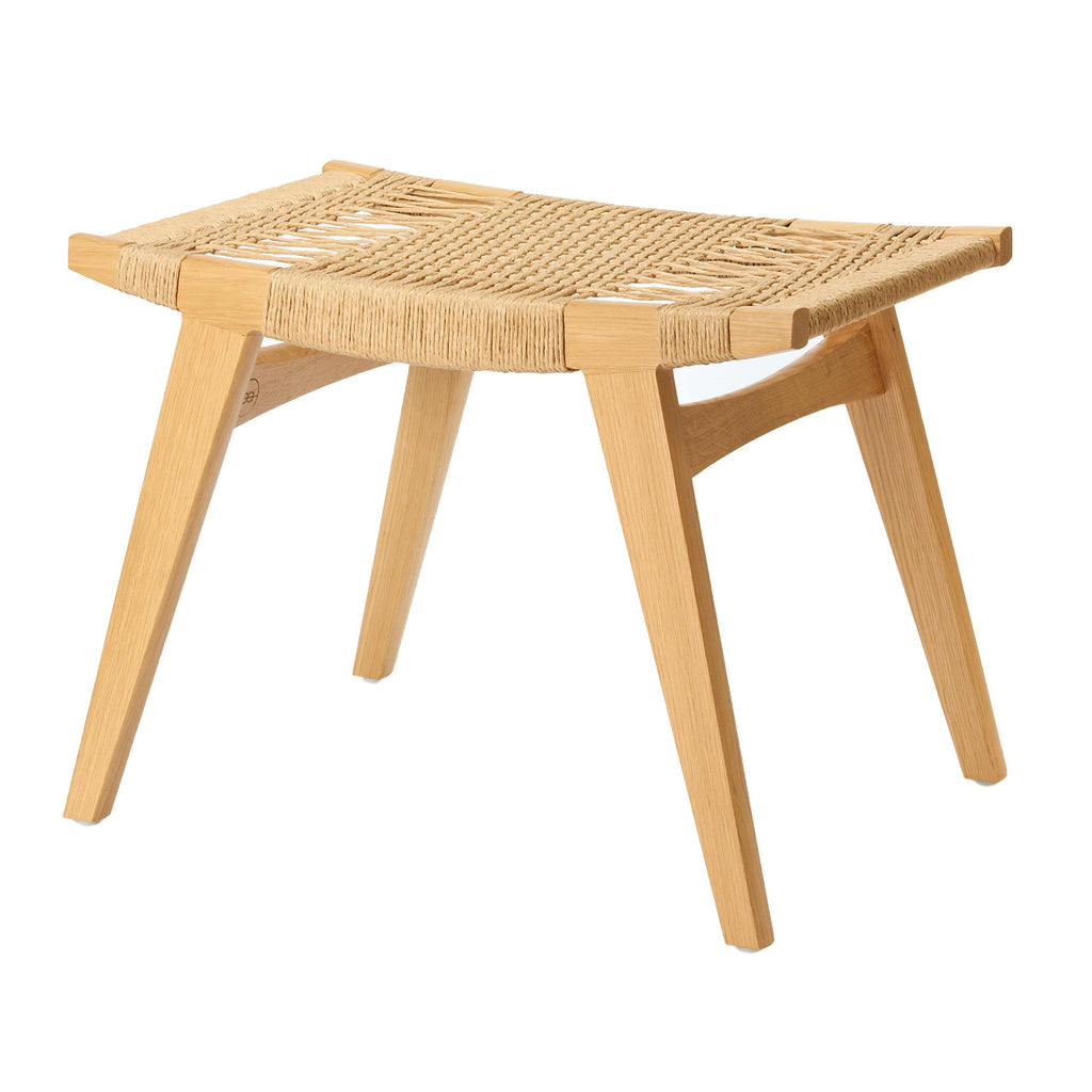 Photo of a natural oak and natural Danish Cord pi stool on a white background.