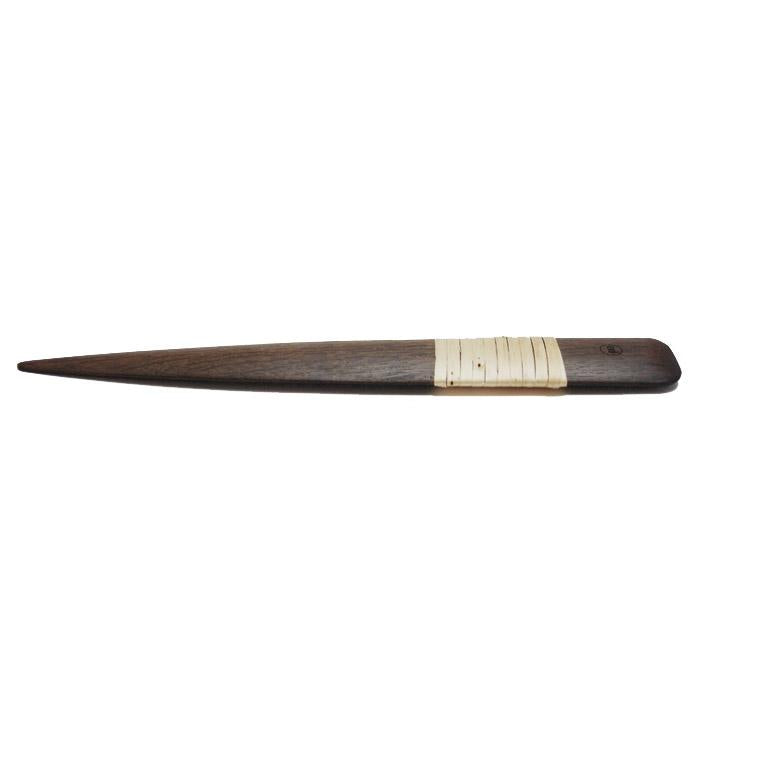 Photo of a black bog oak letter opener, handle wrapped in willow skein, on a white background.