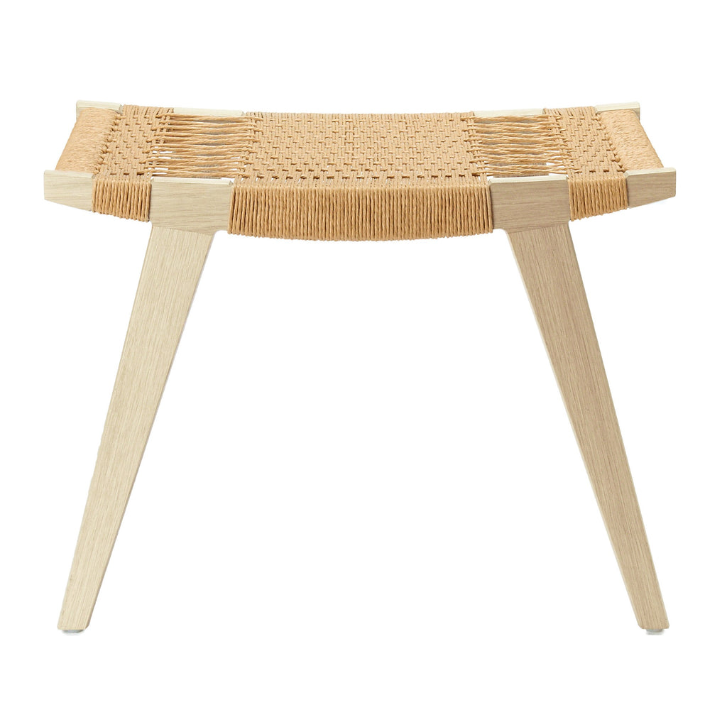 Photo of a limed oak and natural Danish Cord pi stool on a white background.
