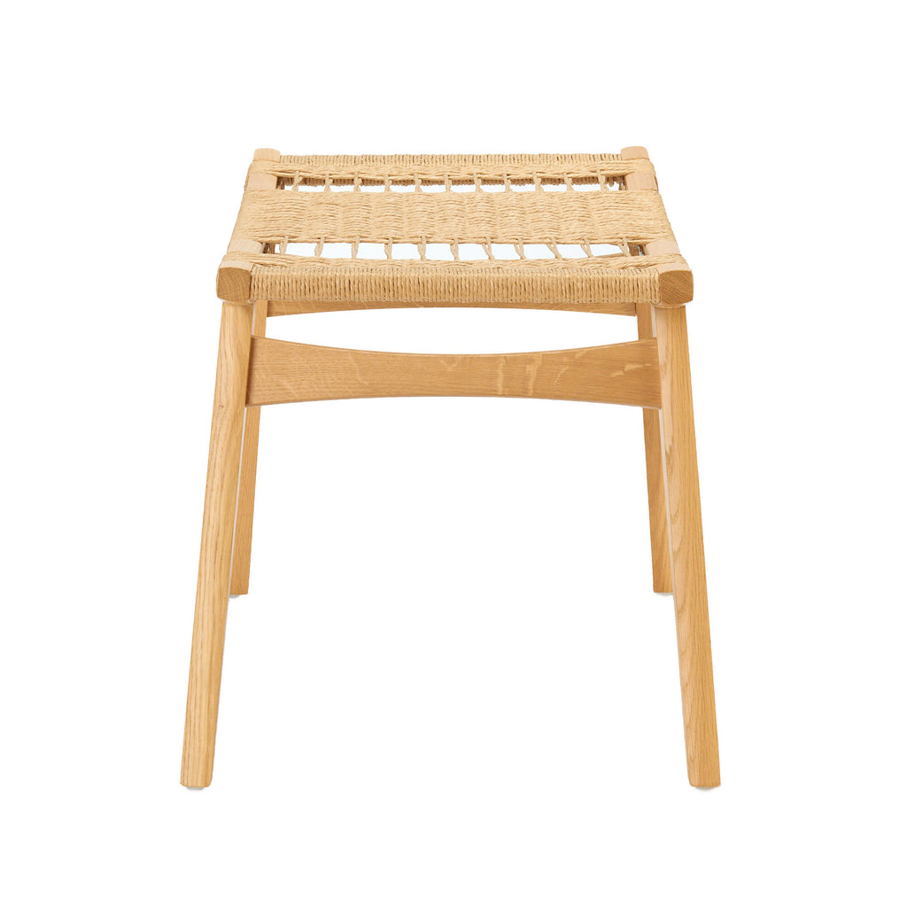 Photo of a natural oak and natural Danish Cord pi stool on a white background.