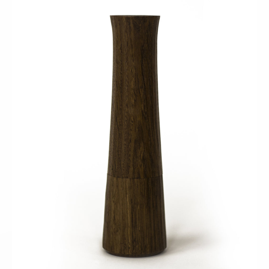 Photo of a fumed oak pepper mill on a white background.