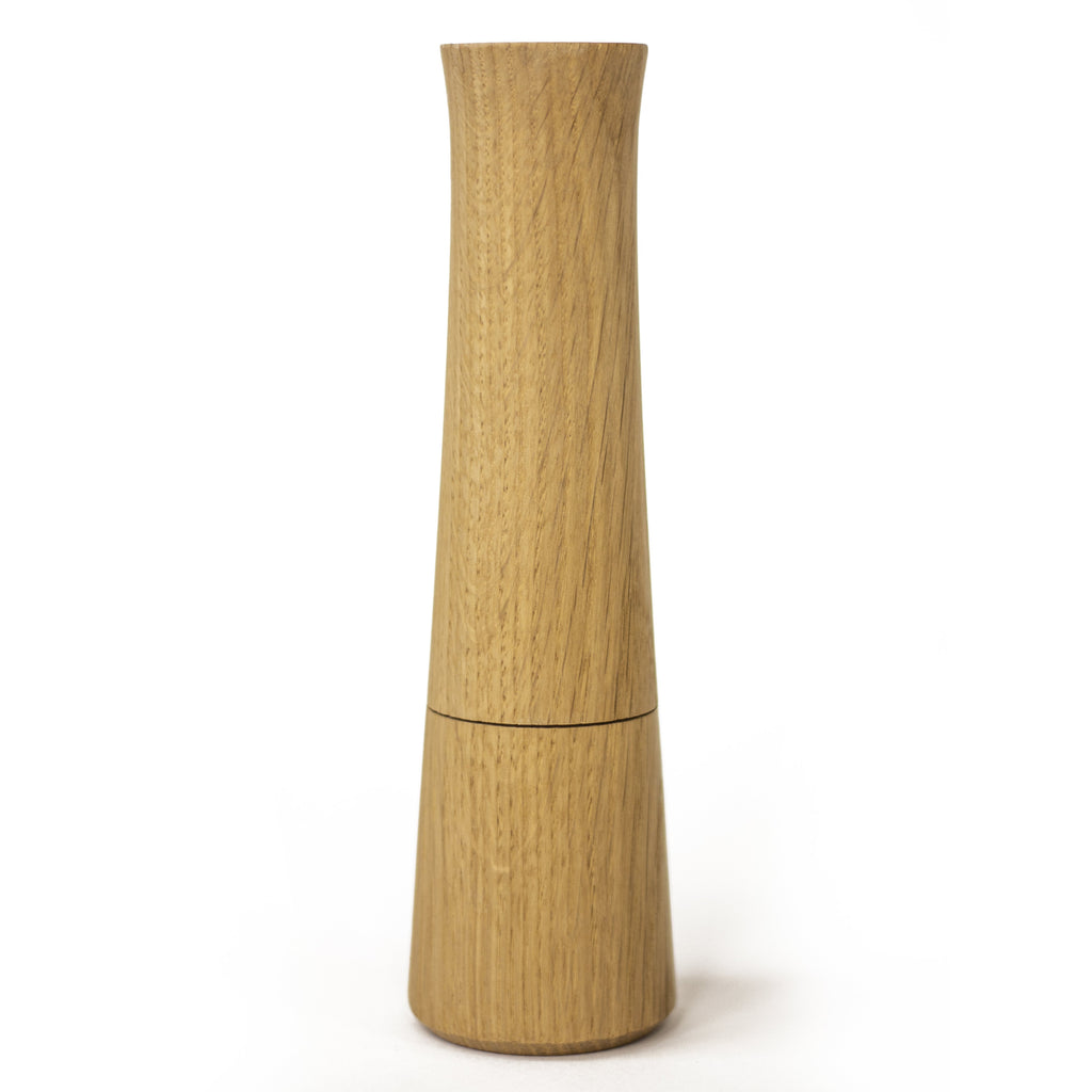 Photo of a natural oak pepper mill on a white background.